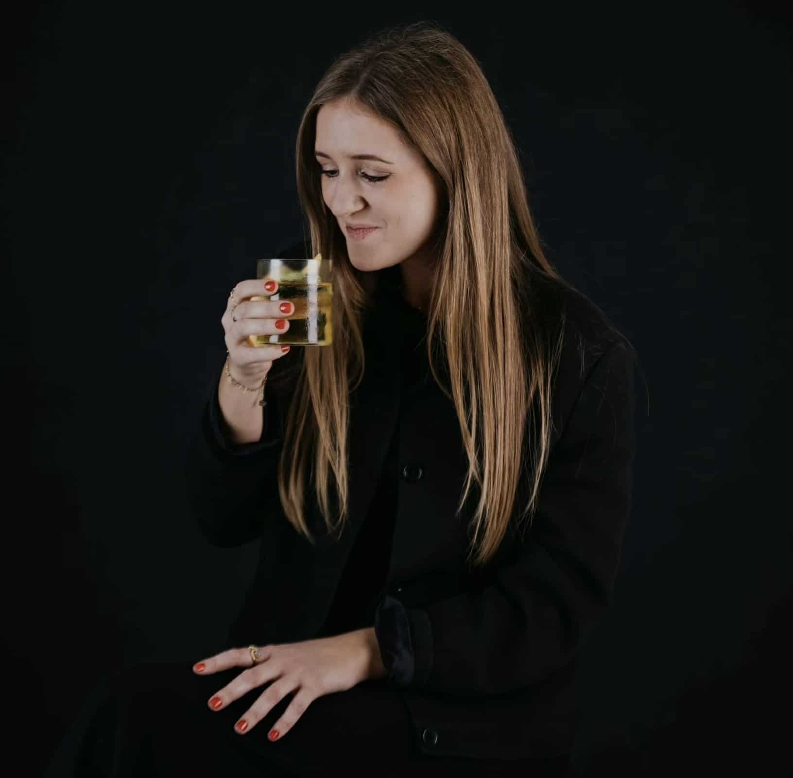Tanne from Gedulgt sipping her favorite cocktail